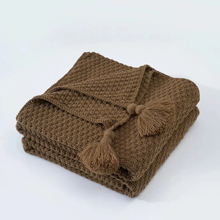 Wolldecke 130 × 160 cm | Gestrickte Kuscheldecke aus 100 % Wolle mit Quasten und dekorativen Kugeln